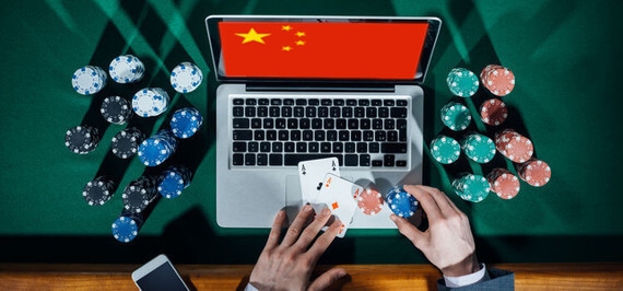 Man plays online poker in China.